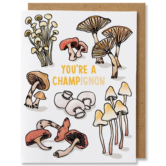 An illustrated greeting card featuring 7 varieties of mushrooms in earth tones with the caption "you're a champignon"