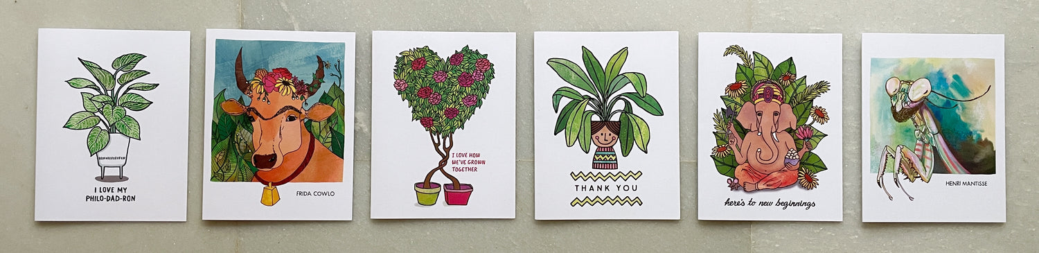 Flatlay image of 6 greeting cards with plant themes. 
