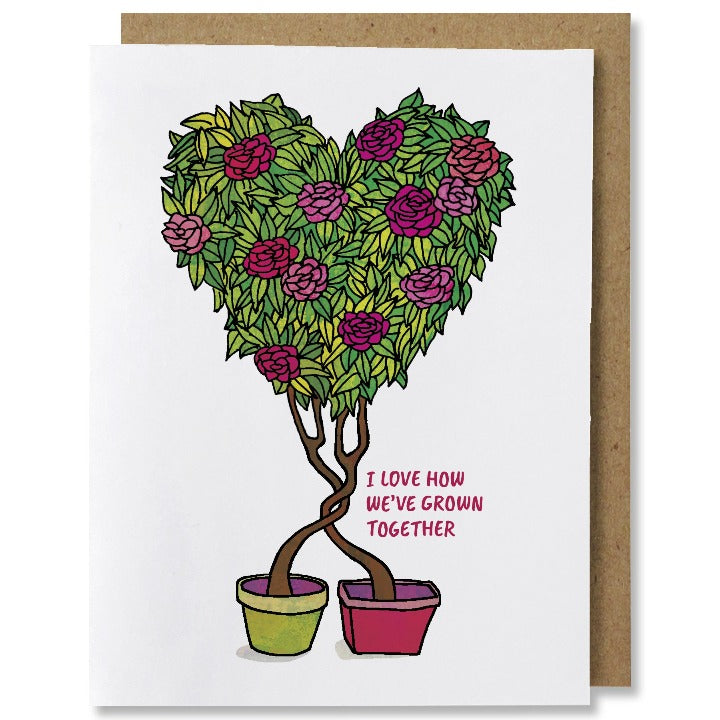 Illustrated love or valentine's greeting card with two planters each with a plant growing out, the trunks twist together and are topped with one green leafy heart shaped rose shrub topiary