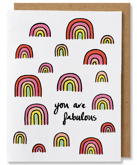 You are Fabulous greeting card features a plethora of rainbows  in shades of pinks, orange, yellow, and light mint. Some rainbows have all the 5 colors, some rainbows have as few as 3 colors. The centers of the rainbows are also color rather than white space and each color band is separated by a black line.The words "You are fabulous" appears in the bottom right quadrant of the card. 