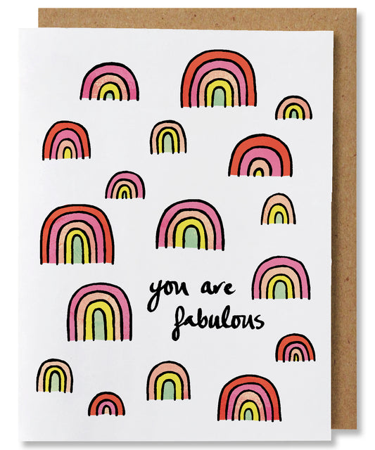 You are Fabulous greeting card features a plethora of rainbows in shades of pinks, orange, yellow, and light mint. Some rainbows have all the 5 colors, some rainbows have as few as 3 colors. The centers of the rainbows are also color rather than white space and each color band is separated by a black line.The words "You are fabulous" appears in the bottom right quadrant of the card.
